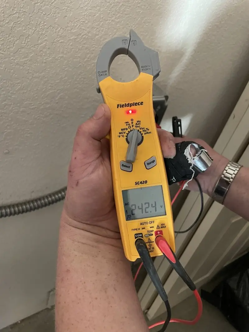 Voltage testing with clamp meter during Electrical Installation Services in Edgewood